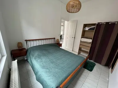 Un ou plusieurs lits dans un hébergement de l'établissement Belle maison quartier Henriville, proche centre
