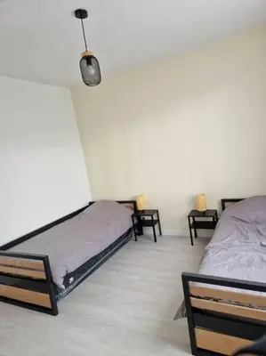 Un ou plusieurs lits dans un hébergement de l'établissement Appart 10 minutes de rouen