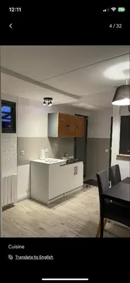 Télévision ou salle de divertissement dans l'établissement Petite maison chaleureuse des boucles de la Seine