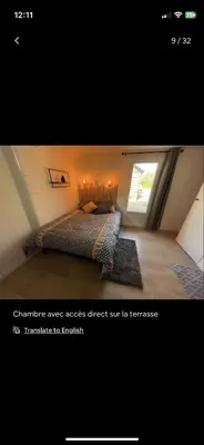 Un ou plusieurs lits dans un hébergement de l'établissement Petite maison chaleureuse des boucles de la Seine