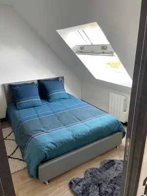 Un ou plusieurs lits dans un hébergement de l'établissement appartement des mésanges