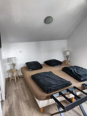 Un ou plusieurs lits dans un hébergement de l'établissement Le Val d'Andé chambres chez habitant