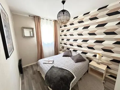 Un ou plusieurs lits dans un hébergement de l'établissement SPACIEUX DUPLEX PRES DES QUAIS DE SEINE LINGE MAISON FOURNI PARKING GRATUIT 4 CHAMBRES bienvenue à vous