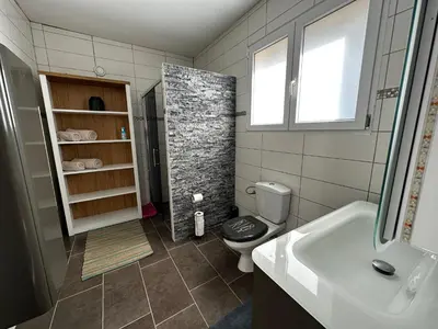 Salle de bains dans l'établissement Le Tipani