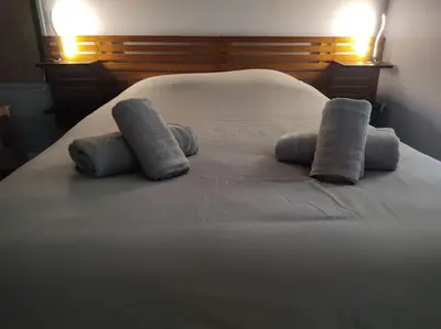Un ou plusieurs lits dans un hébergement de l'établissement Duplex cosy hyper centre