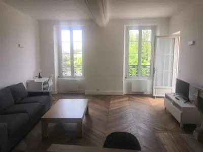 Coin salon dans l'établissement Grand 2P Terrasse bord de seine