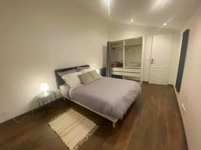 Un ou plusieurs lits dans un hébergement de l'établissement Logement moderne, dans mon jardin, près de Paris et stade de France avec place de stationnement