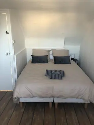 Un ou plusieurs lits dans un hébergement de l'établissement Maison Triplex du jardin des plantes