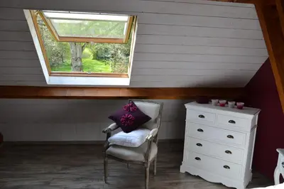 Coin salon dans l'établissement Chambres d'hôtes Villa de Vienne-en-Arthies