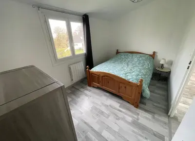 Un ou plusieurs lits dans un hébergement de l'établissement Gîte Le Rhodo