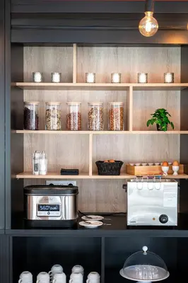 Cuisine ou kitchenette dans l'établissement Nemea Appart Hotel Coliseum Amiens Centre