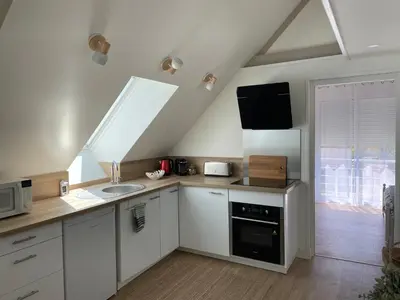 Cuisine ou kitchenette dans l'établissement Le Verger de Sophie