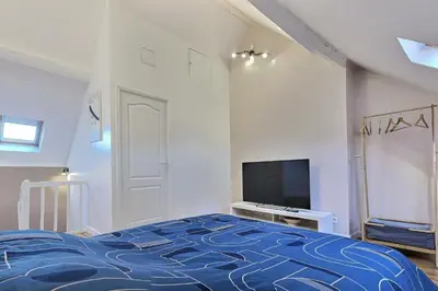 Un ou plusieurs lits dans un hébergement de l'établissement Beau Duplex proche Centre Gare