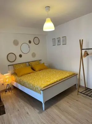 Un ou plusieurs lits dans un hébergement de l'établissement Appartement neuf entièrement équipé proche centre