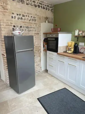 Cuisine ou kitchenette dans l'établissement GITE DE FAMILLE