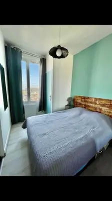 Un ou plusieurs lits dans un hébergement de l'établissement Studio Tribord Le Tréport - vue mer & falaises