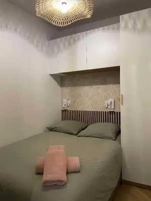 Un ou plusieurs lits dans un hébergement de l'établissement Appartement de charme - Hypercentre Gros Horloge