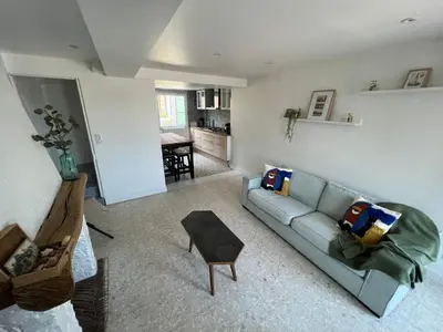 Coin salon dans l'établissement Location de maison Au fil de l O la Bouille