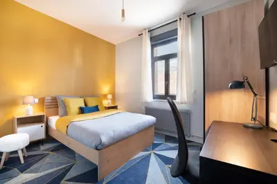 Un ou plusieurs lits dans un hébergement de l'établissement Maison et Jardin - Chambre Cosy