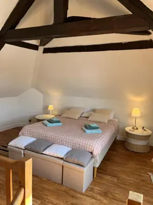 Un ou plusieurs lits dans un hébergement de l'établissement Duplex Beauregard - calme & proche de la plage