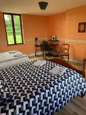 Un ou plusieurs lits dans un hébergement de l'établissement Chambres d'hôtes