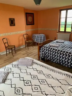 Un ou plusieurs lits dans un hébergement de l'établissement Chambres d'hôtes