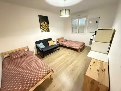 Un ou plusieurs lits dans un hébergement de l'établissement Maison Le Bois Petit