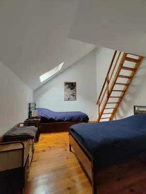 Un ou plusieurs lits dans un hébergement de l'établissement Cosy appartement 2 chambres
