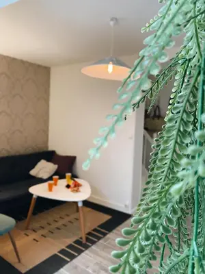 Coin salon dans l'établissement Maison cosy avec 3 chambres et 3 salles de bains