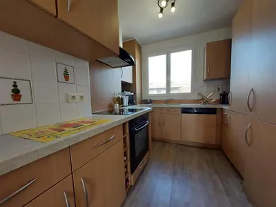 Cuisine ou kitchenette dans l'établissement Le Petit Horloge