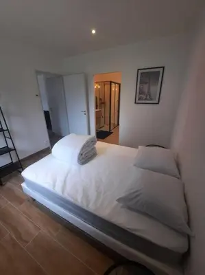 Un ou plusieurs lits dans un hébergement de l'établissement Appartement à la campagne