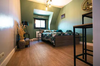 Un ou plusieurs lits dans un hébergement de l'établissement Green cosy