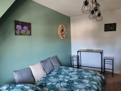 Un ou plusieurs lits dans un hébergement de l'établissement Green cosy