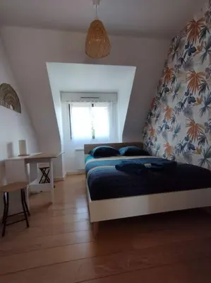 Un ou plusieurs lits dans un hébergement de l'établissement Le ptit nid de Louviers TV/Fibre