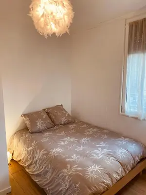 Un ou plusieurs lits dans un hébergement de l'établissement Cozy little house