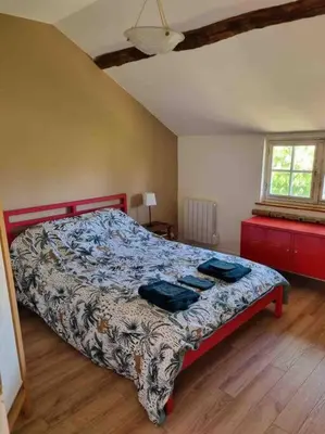 Un ou plusieurs lits dans un hébergement de l'établissement Maison de famille à la campagne classée 3 étoiles