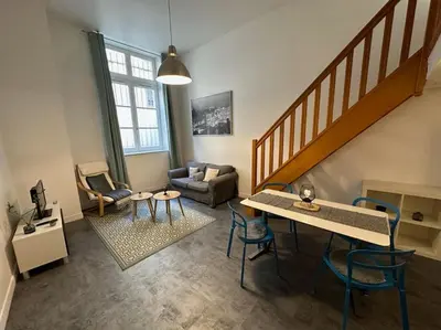Coin salon dans l'établissement Appartement dans ancien Hôtel historique