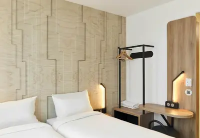 Un ou plusieurs lits dans un hébergement de l'établissement B&B HOTEL Cergy Saint-Christophe Gare