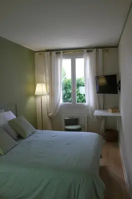 Un ou plusieurs lits dans un hébergement de l'établissement Chambres à la maison Hermitage