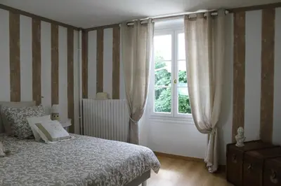 Un ou plusieurs lits dans un hébergement de l'établissement Chambres à la maison Hermitage