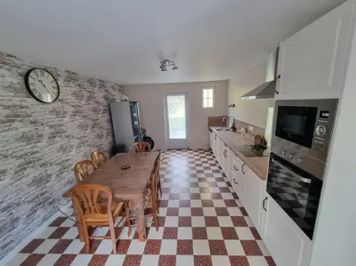 Cuisine ou kitchenette dans l'établissement Maison 8-10 personnes