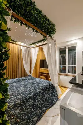 Un ou plusieurs lits dans un hébergement de l'établissement Proche Paris - Style Bali 350 m gare Mantes