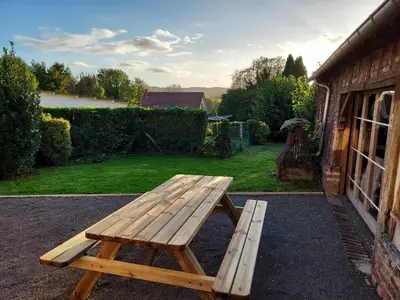 Jardin de l'établissement Le Refuge de Normandie avec Spa et Cheminée