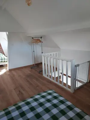 Un ou plusieurs lits dans un hébergement de l'établissement Le Refuge de Normandie avec Spa et Cheminée