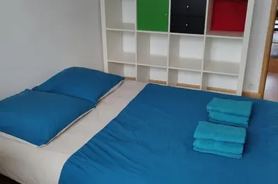 Un ou plusieurs lits dans un hébergement de l'établissement Poissy Appartement 2 chambres