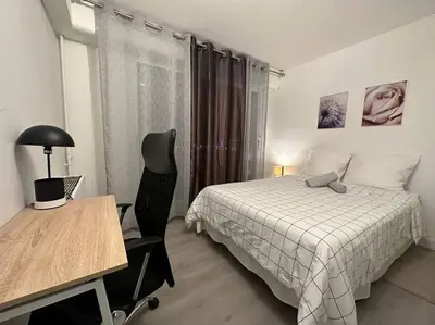 Un ou plusieurs lits dans un hébergement de l'établissement IMEPA Appart 47m2/ Beau 2 pièces