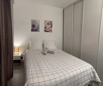 Un ou plusieurs lits dans un hébergement de l'établissement IMEPA Appart 47m2/ Beau 2 pièces