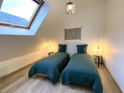 Un ou plusieurs lits dans un hébergement de l'établissement Le Loft boisé Giverny-Vernon - appt 8