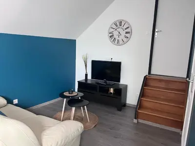 Télévision ou salle de divertissement dans l'établissement Appartement Amiens-Camon