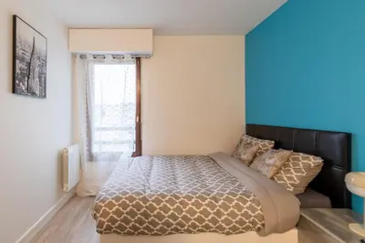 Un ou plusieurs lits dans un hébergement de l'établissement Le Beau Refuge Parisien de Cergy - Parisian modern flat at Cergy